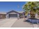 Charming single-story home featuring a well-maintained front yard and two-car garage at 6154 S Borego Rd, Gold Canyon, AZ 85118