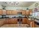 This kitchen features wood cabinets, stainless steel appliances, and an island countertop space at 6154 S Borego Rd, Gold Canyon, AZ 85118