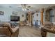 Spacious living room with wood-look floors, comfortable seating, and decorative design elements at 6154 S Borego Rd, Gold Canyon, AZ 85118