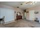 This bedroom has neutral walls, ceiling fan, carpeting, and an open floorplan at 6154 S Borego Rd, Gold Canyon, AZ 85118