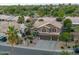 Beautiful home featuring desert landscaping, a tile roof, and a three car garage at 630 W Saragosa St, Chandler, AZ 85225