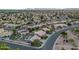 Birds-eye view of a sprawling residential neighborhood in a desert landscape featuring multiple homes with pools at 630 W Saragosa St, Chandler, AZ 85225