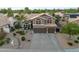 Inviting home featuring manicured landscaping, desert landscaping, and an attached three car garage at 630 W Saragosa St, Chandler, AZ 85225