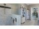 Modern bathroom featuring marble tile shower with glass partition and decorative tile flooring at 630 W Saragosa St, Chandler, AZ 85225