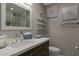 Stylish bathroom features a vanity with a sleek sink, a modern faucet, and decorative elements at 630 W Saragosa St, Chandler, AZ 85225