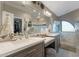 Bright, spacious bathroom with dual sinks, white countertop and decorative mirror, offering a touch of elegance at 630 W Saragosa St, Chandler, AZ 85225