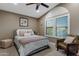 Comfortable bedroom with vaulted ceiling, ceiling fan, a big window and a cozy chair perfect for relaxing at 630 W Saragosa St, Chandler, AZ 85225