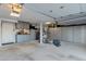 Spacious garage with ample storage cabinets, overhead lighting, and epoxy flooring at 630 W Saragosa St, Chandler, AZ 85225