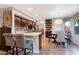 Bright open concept kitchen with breakfast bar seating flows into a dining area and showcases a modern design at 630 W Saragosa St, Chandler, AZ 85225
