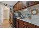Well-equipped laundry room features modern washer, dryer, ample cabinetry and sink with stylish faucet at 630 W Saragosa St, Chandler, AZ 85225