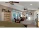 Large main bedroom featuring plush seating area, ceiling fans, and large windows at 630 W Saragosa St, Chandler, AZ 85225