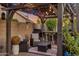 Outdoor patio with covered pergola with lights, bar, furniture, and brick flooring at 630 W Saragosa St, Chandler, AZ 85225