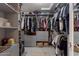 Spacious walk-in closet with custom shelving and organization, providing ample storage space for clothes and accessories at 630 W Saragosa St, Chandler, AZ 85225