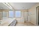 Bathroom with a double vanity, bathtub and shower at 6923 W Laredo St, Chandler, AZ 85226