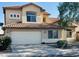 Two story home featuring tile roofing, stucco siding, attached two car garage and manicured front yard at 6923 W Laredo St, Chandler, AZ 85226