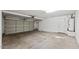 Spacious two-car garage featuring an automatic door opener, a water heater, and ample space for storage at 6923 W Laredo St, Chandler, AZ 85226