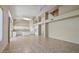 Open concept living space leading to a kitchen, featuring tile flooring, high ceilings, and large windows at 6923 W Laredo St, Chandler, AZ 85226