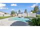 Backyard view of the sparkling private pool, raised spa, and lush landscaping at 6923 W Laredo St, Chandler, AZ 85226