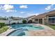 Backyard view of the sparkling private pool and raised spa with lush landscaping at 6923 W Laredo St, Chandler, AZ 85226