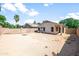 Spacious backyard featuring a block wall, patio and desert landscaping at 742 E Lovegrass Dr, San Tan Valley, AZ 85143