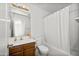 Bathroom featuring a white vanity, toilet, shower and bathtub with curtain at 742 E Lovegrass Dr, San Tan Valley, AZ 85143