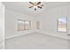Bright bedroom with carpet, vaulted ceilings, and multiple windows providing natural light at 742 E Lovegrass Dr, San Tan Valley, AZ 85143