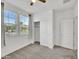 Bright bedroom features plush carpet, large windows, and a closet for ample storage at 8140 W Lane Ave, Glendale, AZ 85303