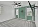 This is a bedroom that has a ceiling fan, carpet and a decorative compass on the wall at 8140 W Lane Ave, Glendale, AZ 85303