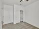 Bedroom features soft carpet, white closet doors, a ceiling fan, and ample lighting at 8140 W Lane Ave, Glendale, AZ 85303