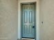 Stylish front door in a neutral color, providing a secure and elegant entrance to the house at 8140 W Lane Ave, Glendale, AZ 85303