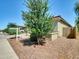 Attractive house showcasing desert landscaping, a well-kept lawn, and a pleasant outdoor space at 8140 W Lane Ave, Glendale, AZ 85303