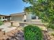 Charming house featuring desert landscaping, a wide driveway, and a welcoming front entryway at 8140 W Lane Ave, Glendale, AZ 85303