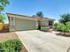 Charming one-story home with a two-car garage and low-maintenance desert landscaping at 8140 W Lane Ave, Glendale, AZ 85303