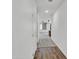 Bright hallway with fresh paint and carpet, providing access to the living areas at 8140 W Lane Ave, Glendale, AZ 85303