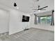 Bright living room with neutral paint, carpet, ceiling fan, recessed lighting, and large windows at 8140 W Lane Ave, Glendale, AZ 85303