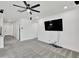 Living room with a ceiling fan, recessed lighting, and a flat-screen television at 8140 W Lane Ave, Glendale, AZ 85303