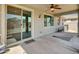 Covered outdoor patio with sliding glass doors and a ceiling fan at 8140 W Lane Ave, Glendale, AZ 85303