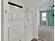 Modern bathroom with a glass-enclosed shower and view to the bedroom at 8140 W Lane Ave, Glendale, AZ 85303