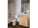 Standard bathroom featuring a tub-shower combo, toilet, and vanity with a mirror, offering essential functionality at 8308 W Baxter Dr, Phoenix, AZ 85037