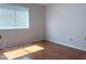 Bedroom featuring wood floors, neutral walls, and natural light at 8308 W Baxter Dr, Phoenix, AZ 85037