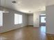 Bright and open living room with tile floors and neutral paint throughout at 8308 W Baxter Dr, Phoenix, AZ 85037
