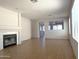 Open-concept living room boasts tile flooring, fireplace, and bright natural light at 8308 W Baxter Dr, Phoenix, AZ 85037