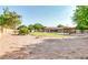 Spacious backyard with a pool, pergola, and mature landscaping, offering privacy and a serene outdoor space at 8532 E San Bruno Dr, Scottsdale, AZ 85258
