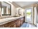 Bathroom with dual sinks, granite countertops, and ample storage space, offering a touch of elegance at 8532 E San Bruno Dr, Scottsdale, AZ 85258
