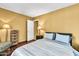 Bedroom features a comfortable bed, decorative lamps, and hardwood flooring at 8532 E San Bruno Dr, Scottsdale, AZ 85258