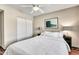 Comfortable bedroom with a queen bed, ceiling fan, and neutral tones, providing a peaceful retreat and ample closet space at 8532 E San Bruno Dr, Scottsdale, AZ 85258