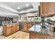 Updated kitchen showcasing stainless steel appliances, granite countertops, abundant natural light and tile flooring at 8532 E San Bruno Dr, Scottsdale, AZ 85258
