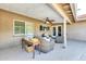 Covered patio featuring comfortable wicker furniture and a ceiling fan, perfect for outdoor relaxation and enjoying the fresh air at 8532 E San Bruno Dr, Scottsdale, AZ 85258