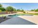 Refreshing pool and backyard oasis with a pergola and lush landscaping, creating a private and serene retreat at 8532 E San Bruno Dr, Scottsdale, AZ 85258