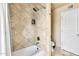 Shower and bathtub combo, featuring tiled walls, offering both style and functionality in the bathroom at 8532 E San Bruno Dr, Scottsdale, AZ 85258
